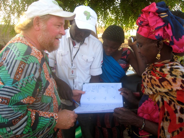Executive Director, Barry Wheeler, listens as CREATE! Field Technician, Macky Ndour, and Cooperative President, Mere Top, discuss work schedules for the Thieneba Garden site.