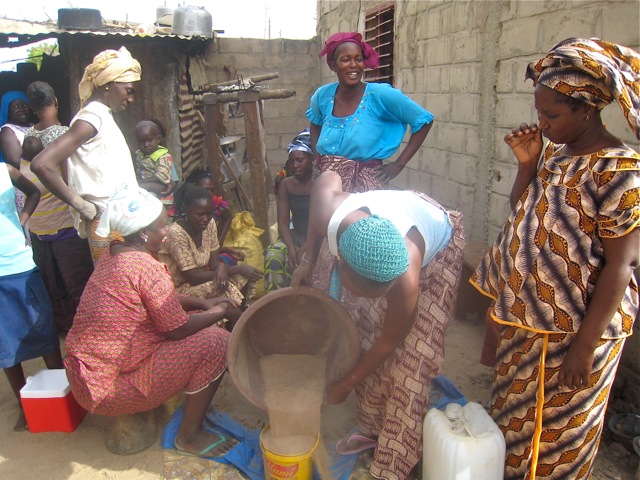 Gathering sand and other materials for construct a CREATE! fuel-efficient cookstove.