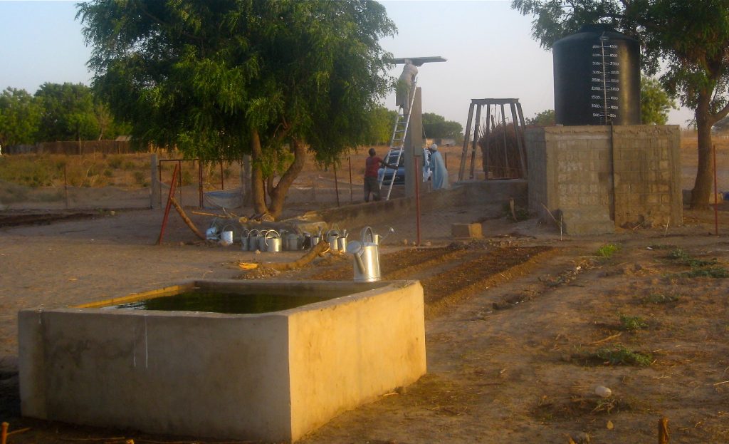 With the solar pumping system in place, water is now pumped effortlessly from the well into an elevated, 1,320-gallon reservoir. Gravity then takes over to disburse water from the reservoir to the four interconnected,1,050-gallon storage basins built on the gardening site, providing 5,520 gallons of above-ground water storage at all times.