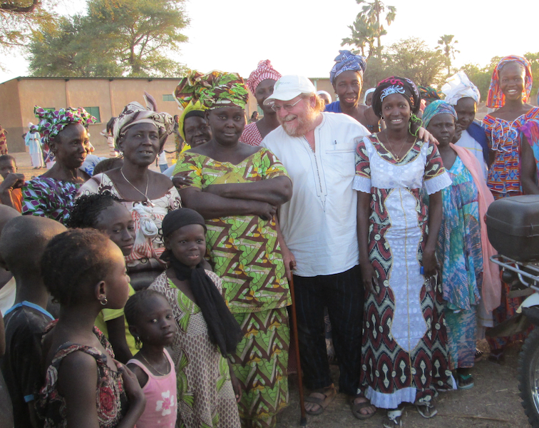 CREATE! Executive Director Barry Wheeler with thankful women in one of CREATE!’s new partner communities. 