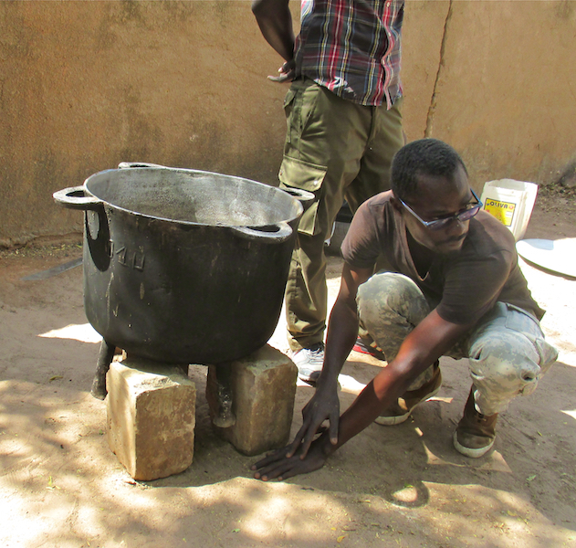 CREATE! field technicians, including Moussa Ndiaye (pictured above) teach women to construct cookstoves using simple and easy accessible techniques, such as measuring with hands and fingers.