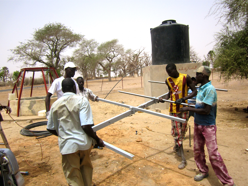 CREATE! field technicians worked with volunteers from Walo to install all of the necessary pieces for the solar installation, including this locally-made “strongback” for the solar panels.