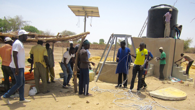 CREATE! field technicians installed the solar-powered pump with the assistance of several young men who live in Darou Diadji.