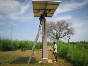 Photos from rural Senegal: Young men in Mboss maintain their solar array